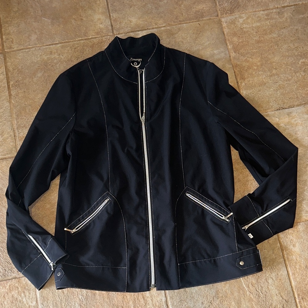 Woman’s zenergy Black Jacket w silver Accents zipper front and buckles. Size 2